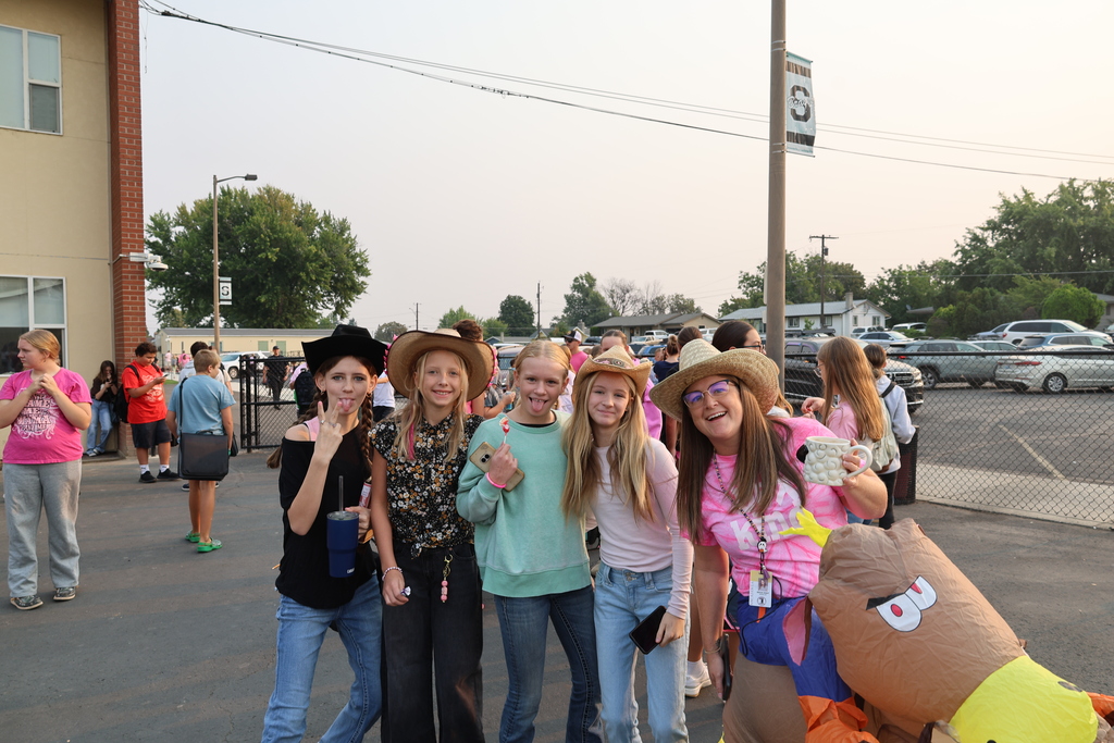 students wearing pink and western clothing
