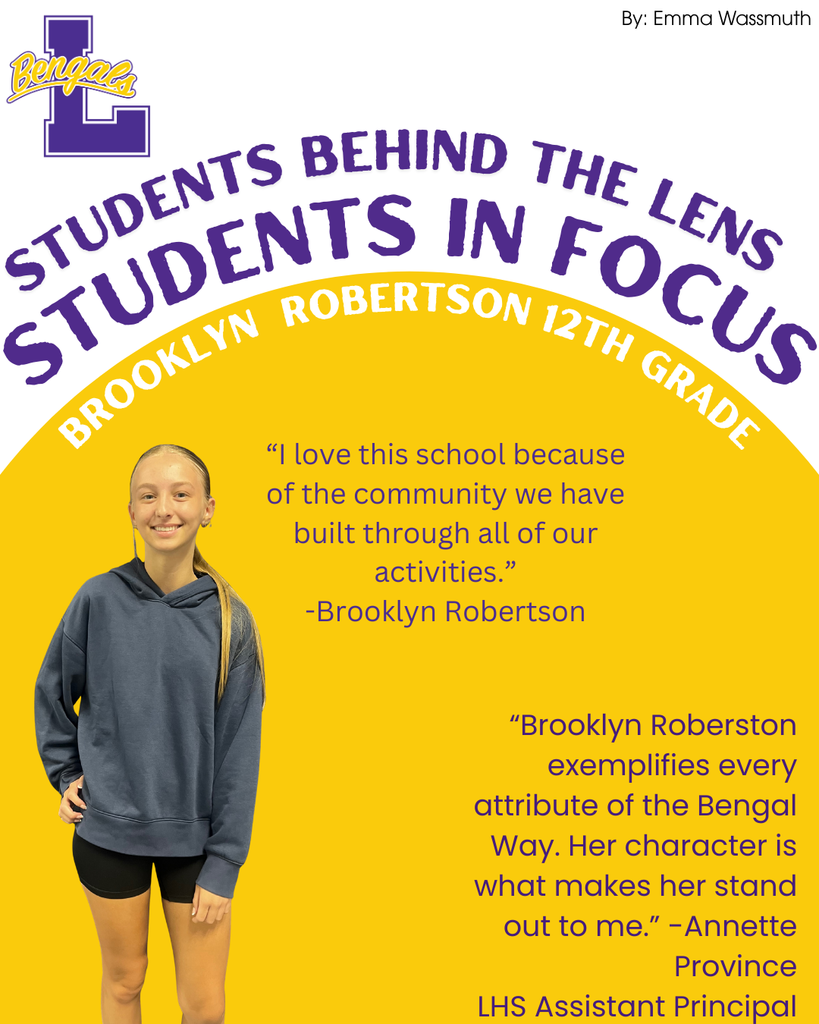 Brooklyn Robertson has a blonde pony tail, grey hoodie, and black shorts
