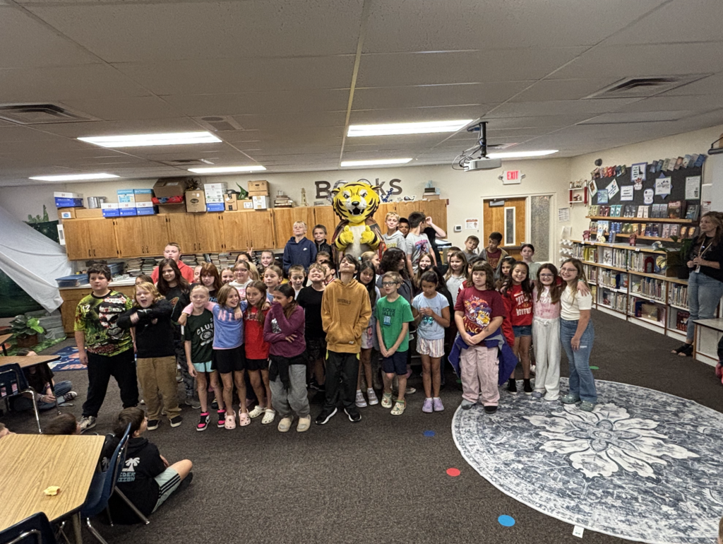 Joe Bengal with students in the library