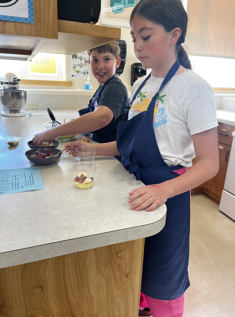 students slicing fruit
