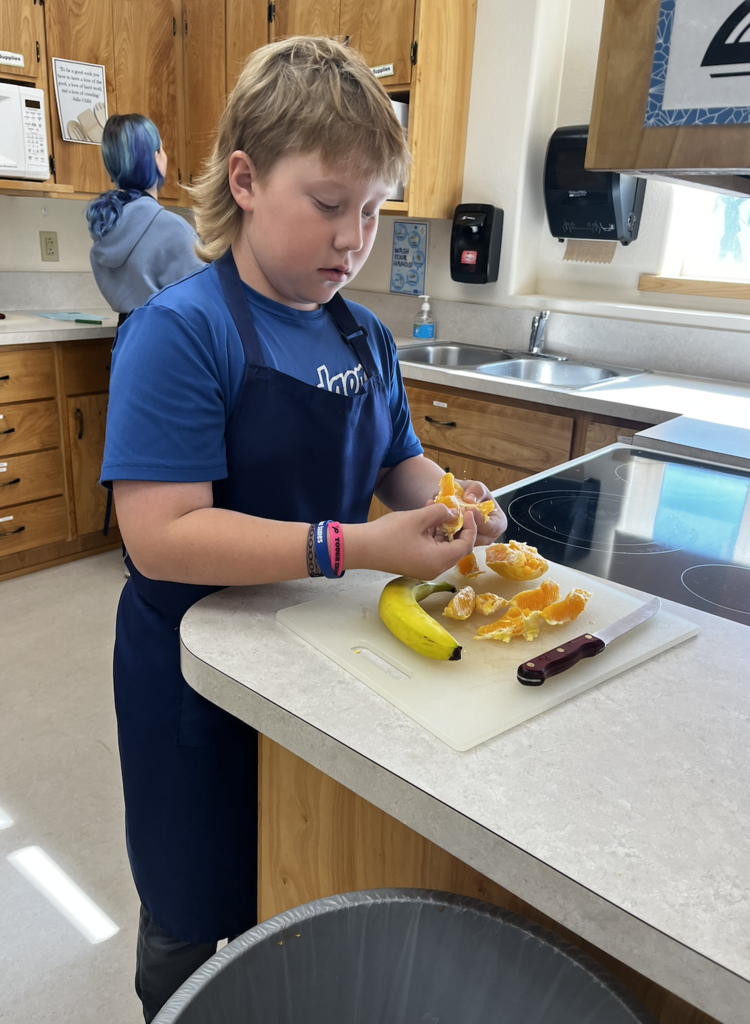 students slicing fruit