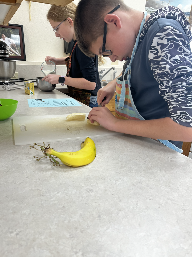 students slicing fruit