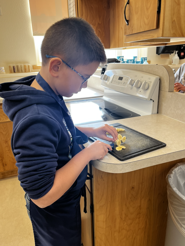 students slicing fruit