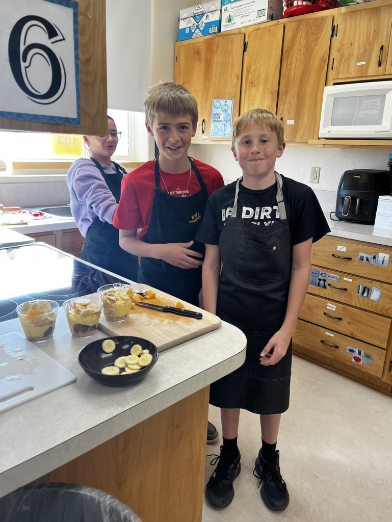 students slicing fruit