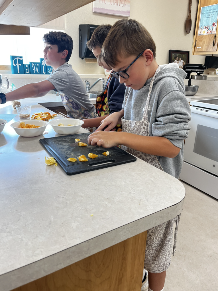students slicing fruit