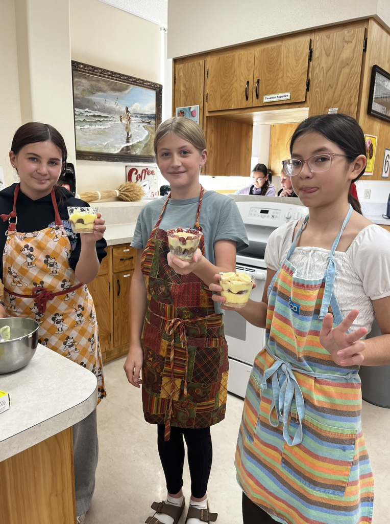 students slicing fruit