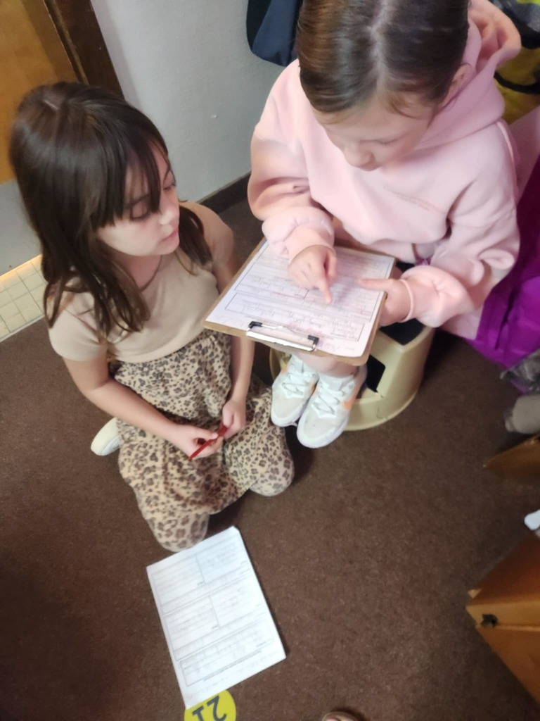 students working together using clipboards