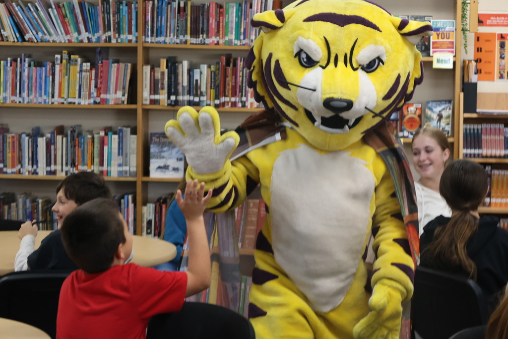 Joe Bengal with students in the library