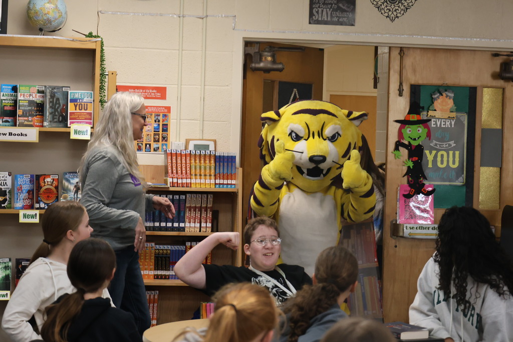 Joe Bengal with students in the library
