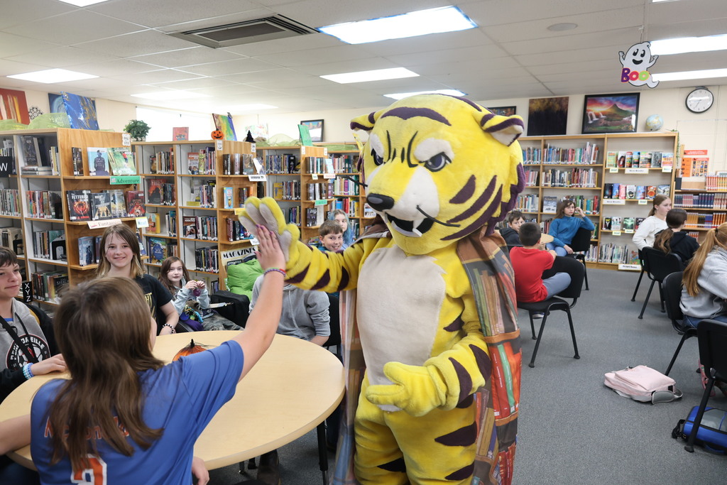 Joe Bengal with students in the library
