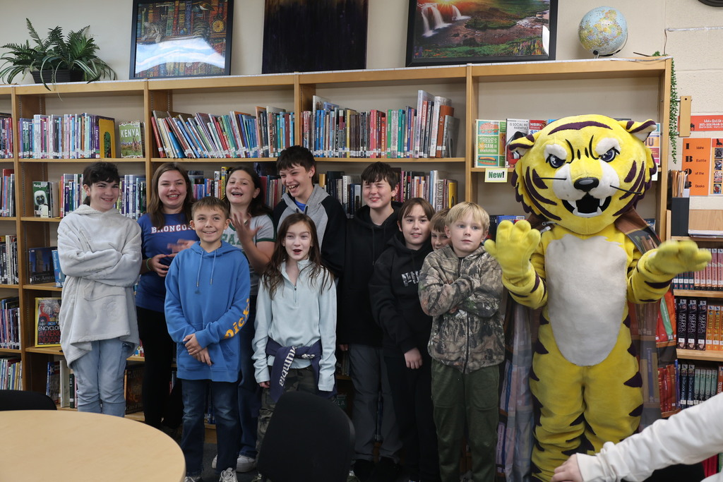 Joe Bengal with students in the library