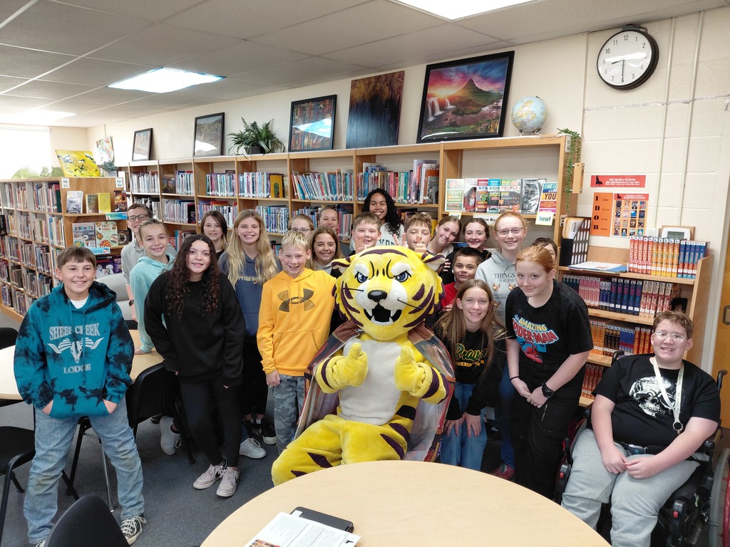 Joe Bengal with students in the library