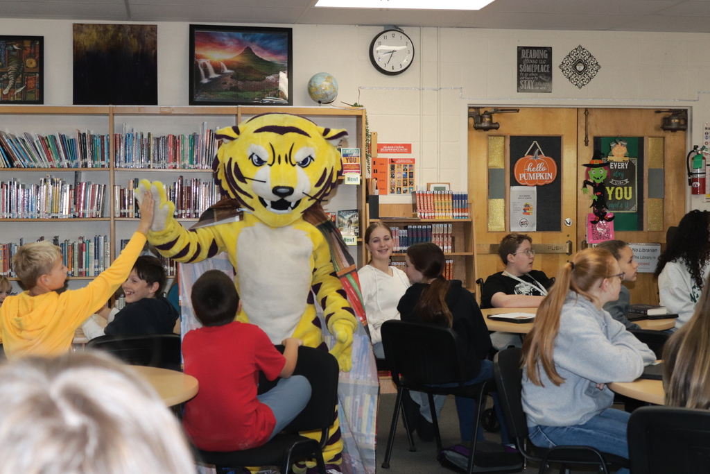 Joe Bengal with students in the library