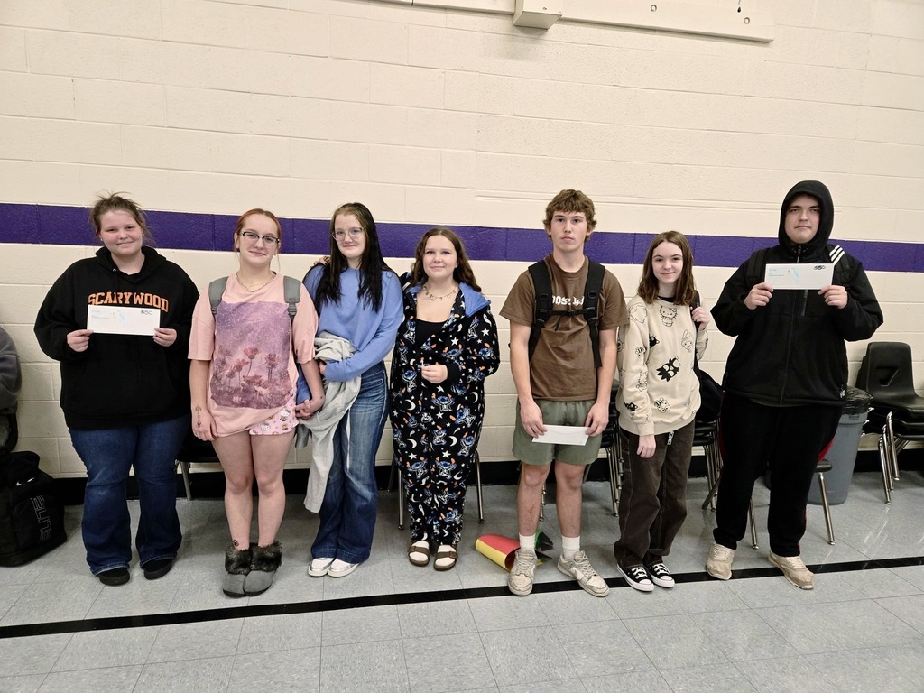 students posing with certificates