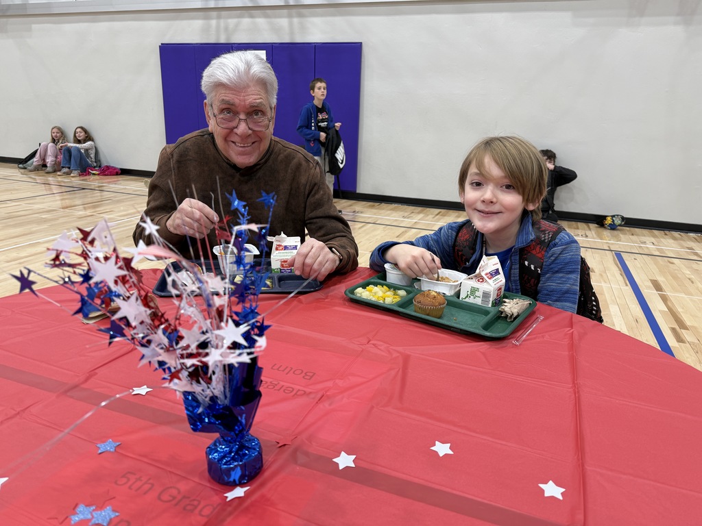 kids eating breakfast with veterans
