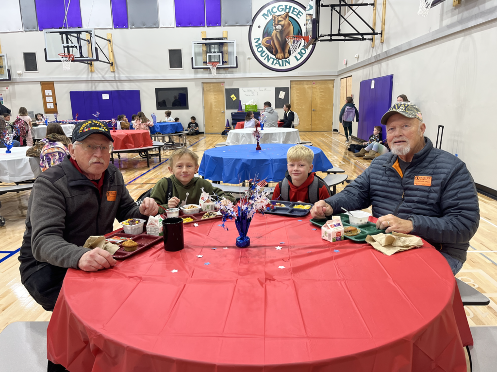 kids eating breakfast with veterans