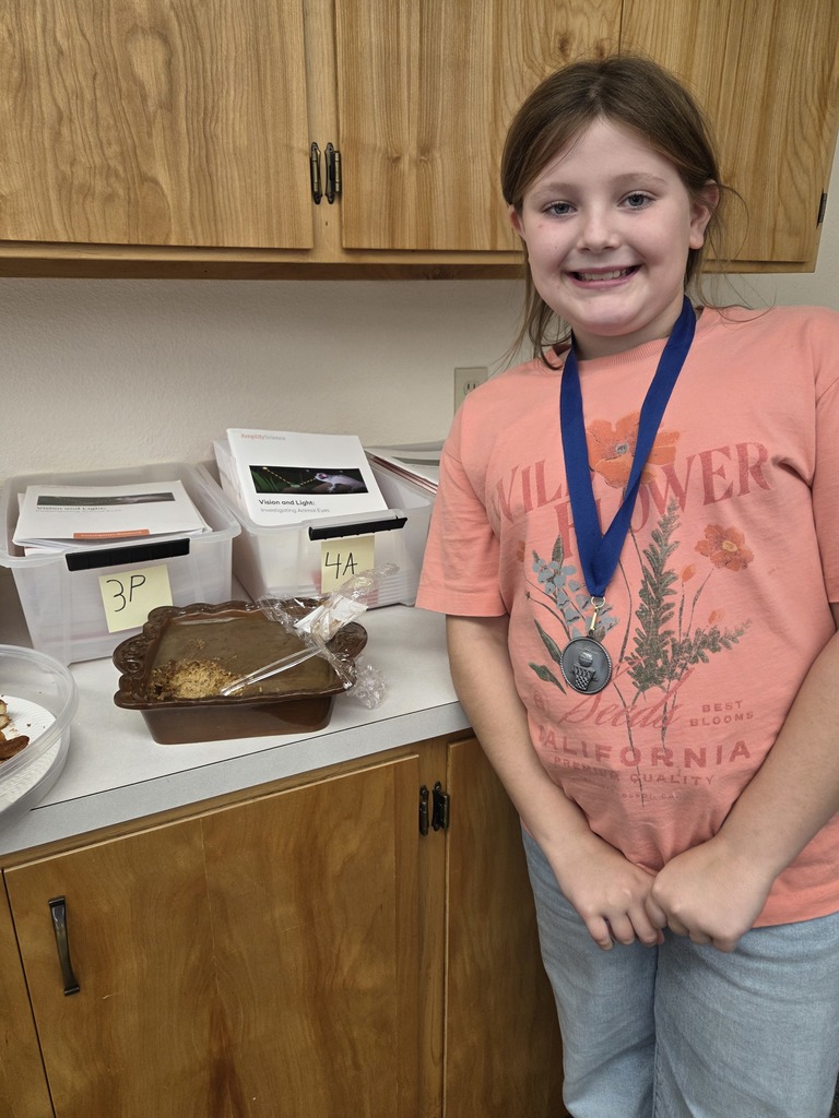 students with the dish they made