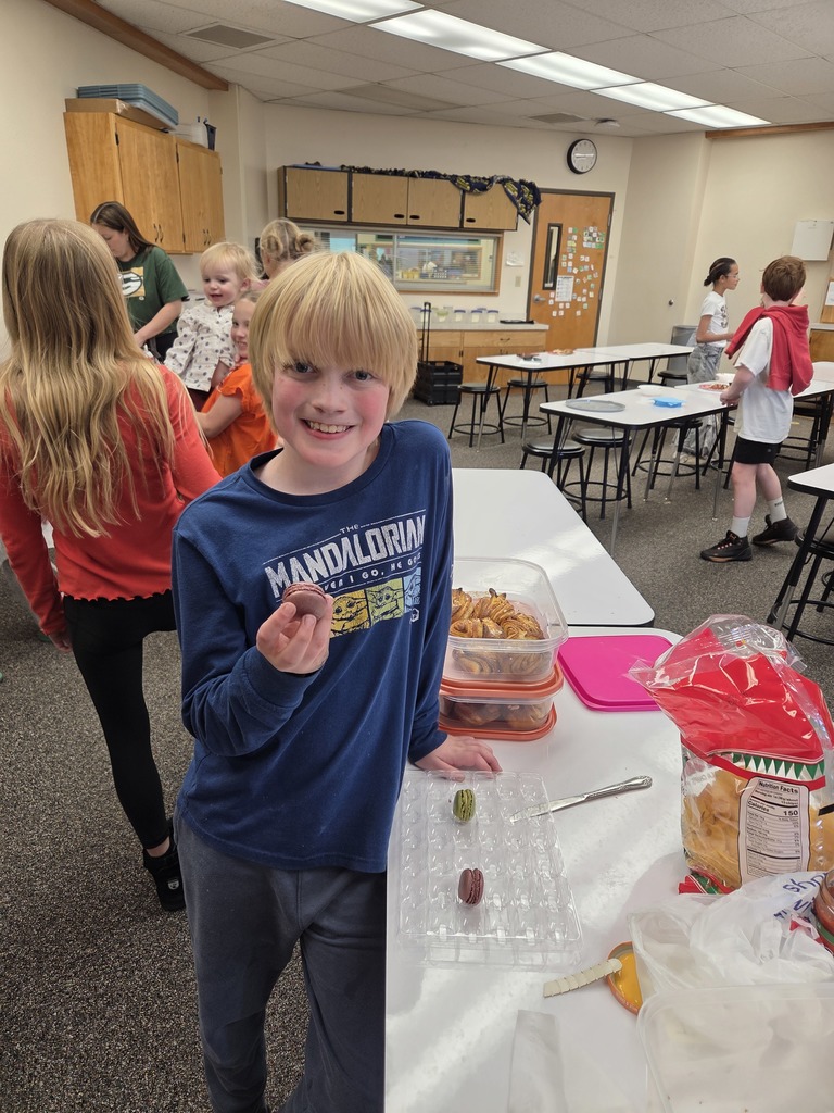 students with the dish they made