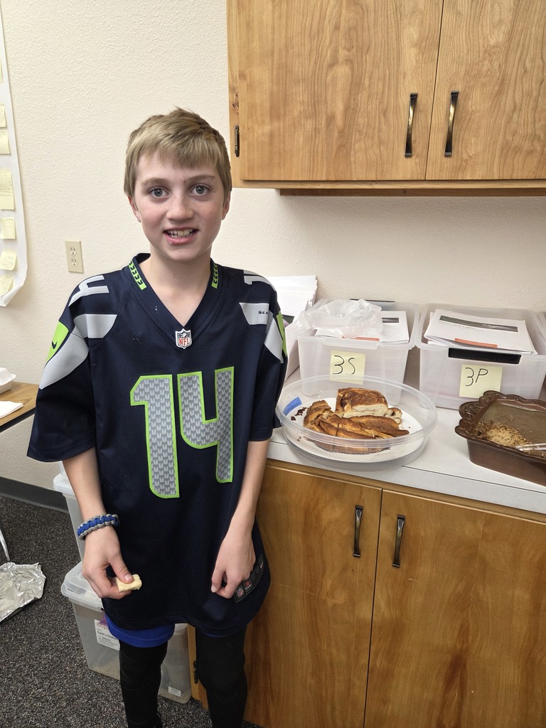 students with the dish they made