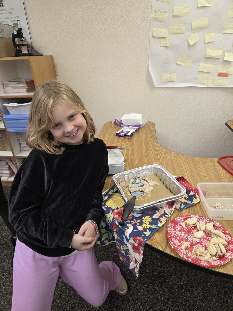 students with the dish they made