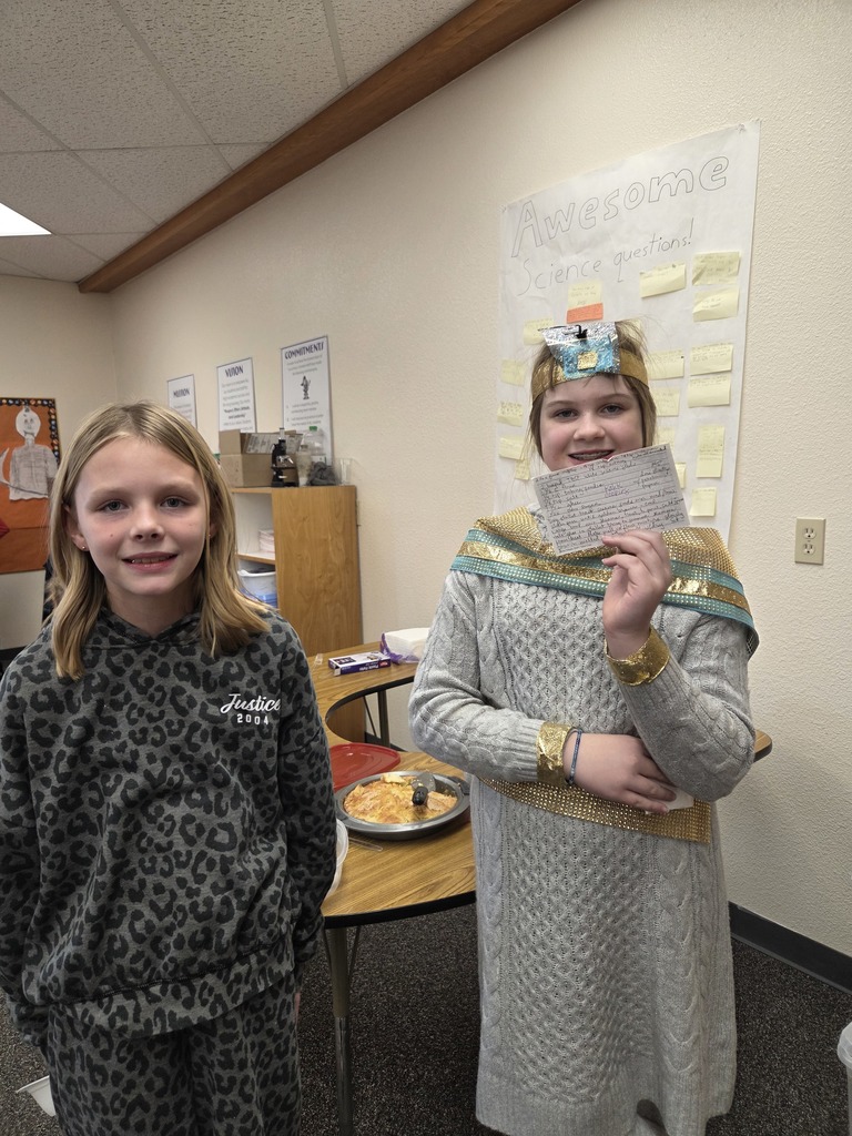 students with the dish they made