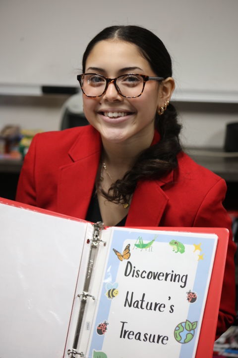student in a red blazer
