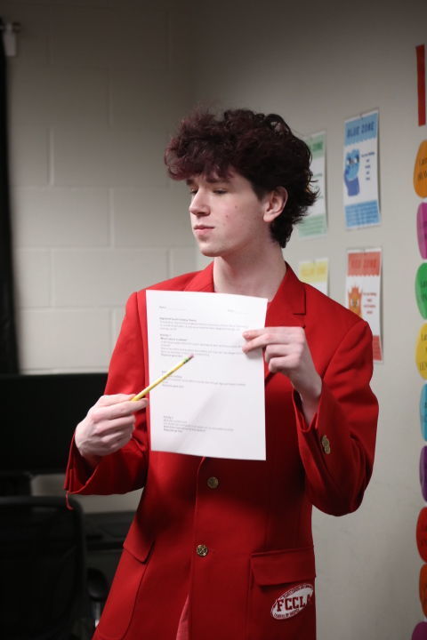 student in a red blazer