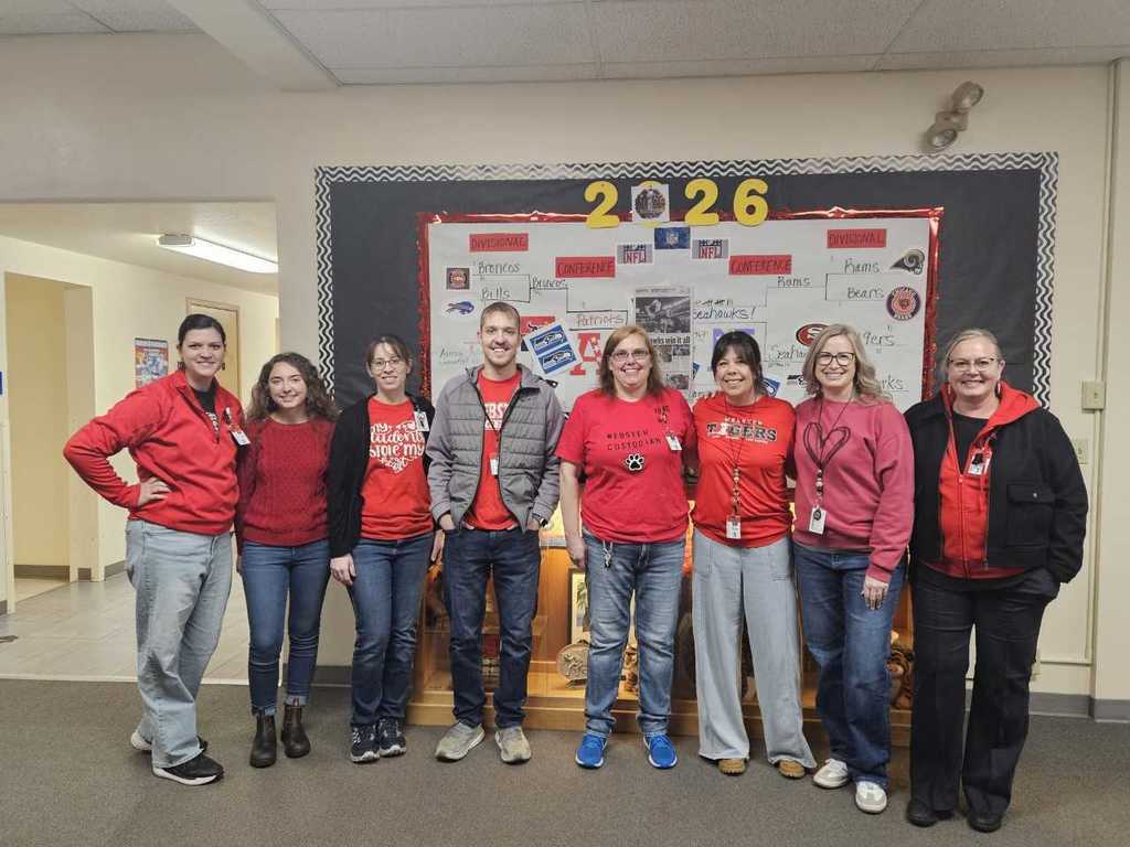 8 Webster staff wearing red shirts