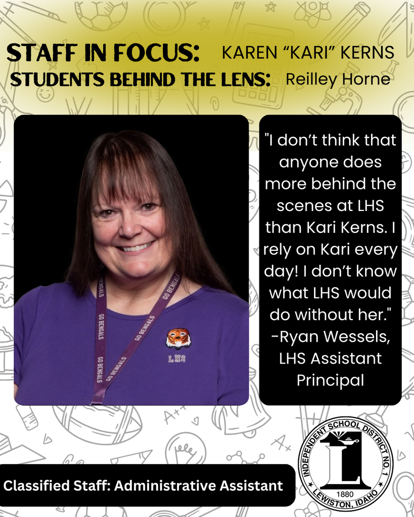 Kari Kerns has a purple shirt on and brown hair with bangs