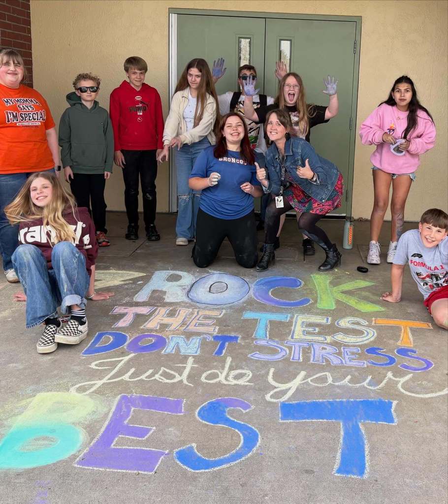 art club students with their sidewalk chalk art