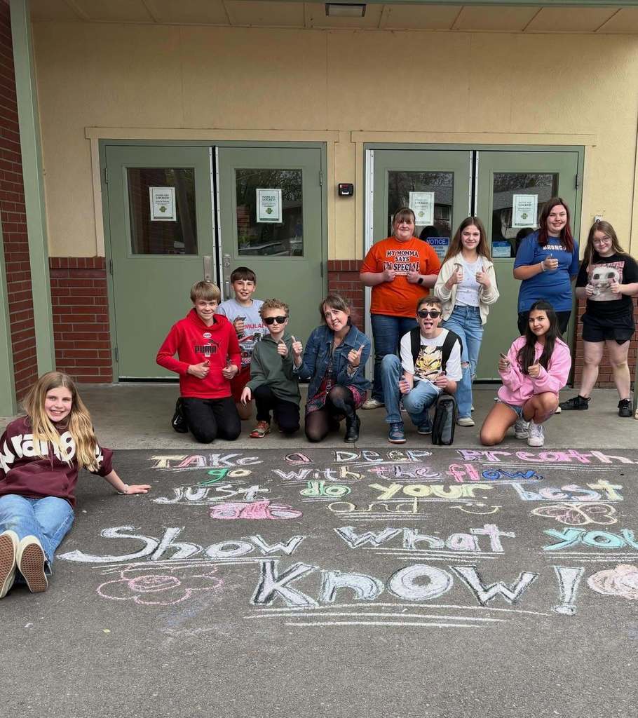 art club students with their sidewalk chalk art