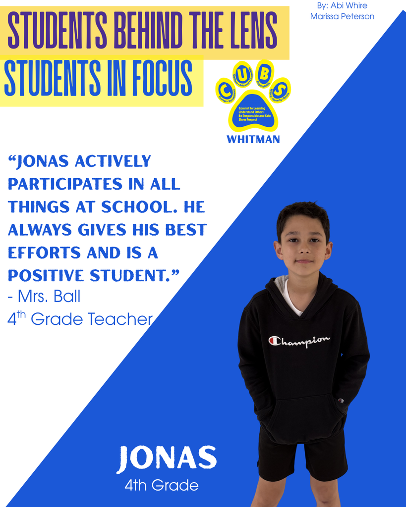 Jonas has a black sweatshirt and black shorts on. he also has brown hair