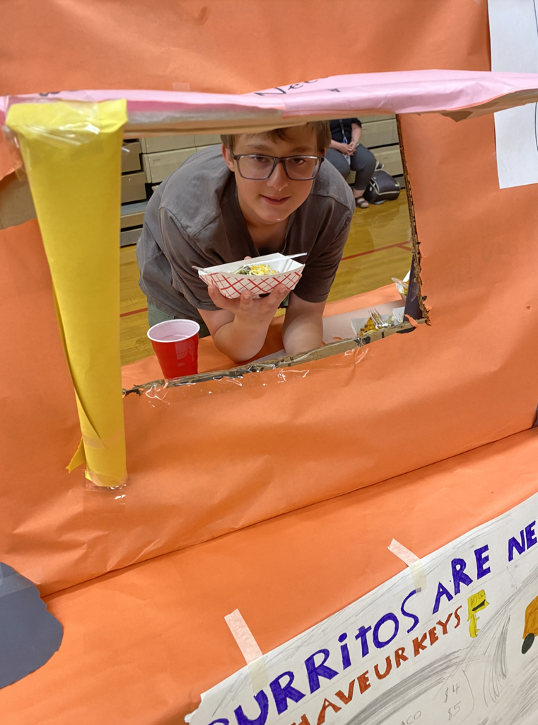 students with their food truck projects