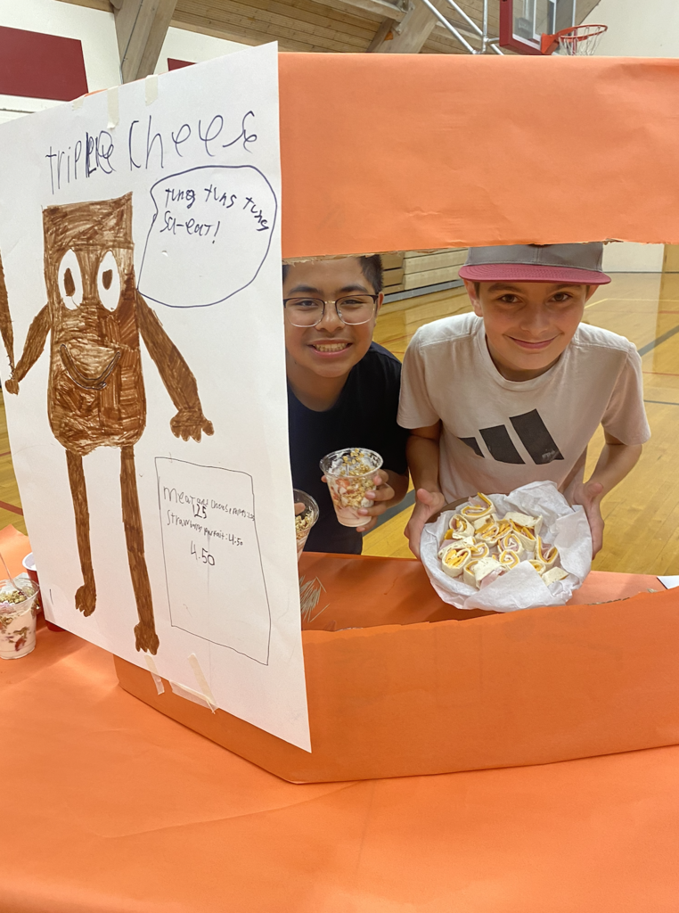 students with their food truck projects