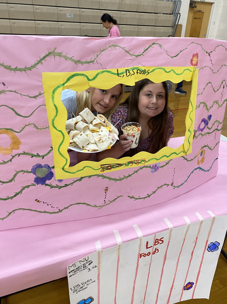 students with their food truck projects
