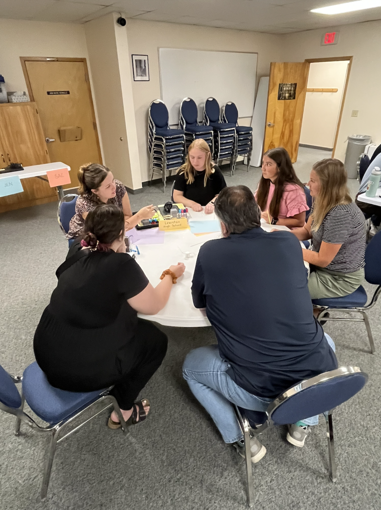teachers working together at round tables