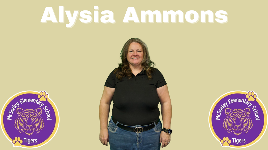 woman with a black polo, black belt, blue jeans, brown curled hair