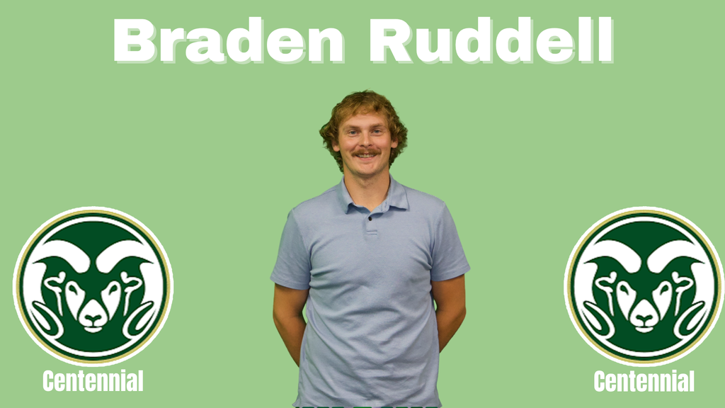 Braden has longer sandy hair and a mustache, he is wearing a light blue polo shirt