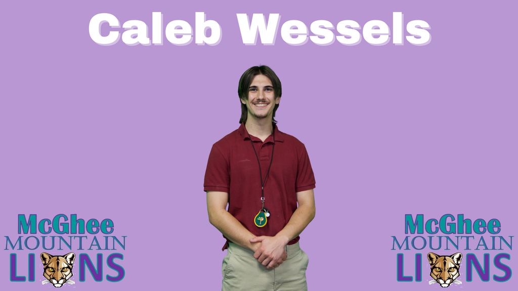 man with brown hair, mustache, red polo shirt, khaki pants