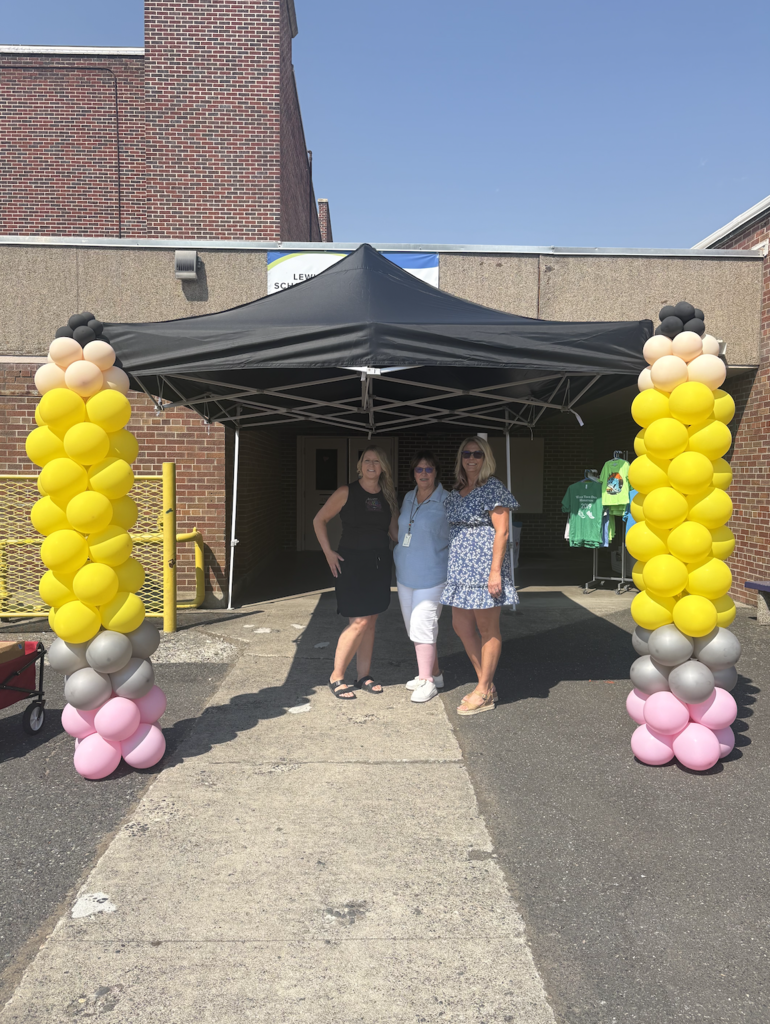 3 women with balloon displays
