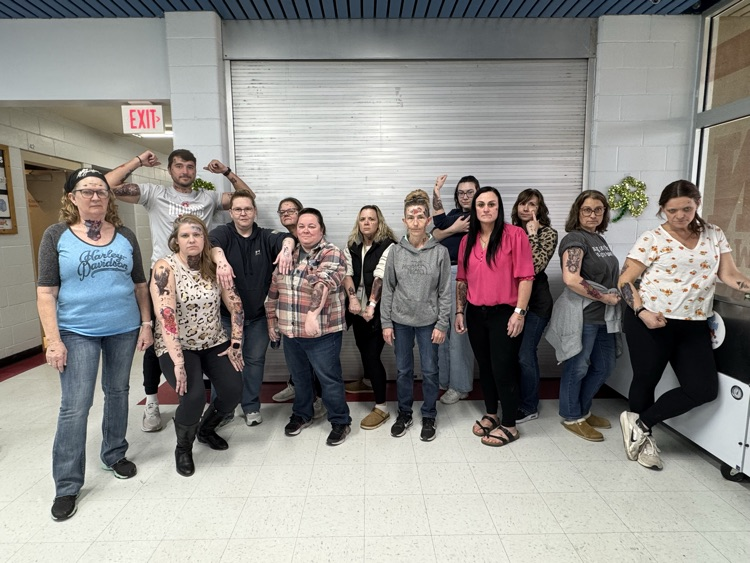 teachers with temporary tattoos