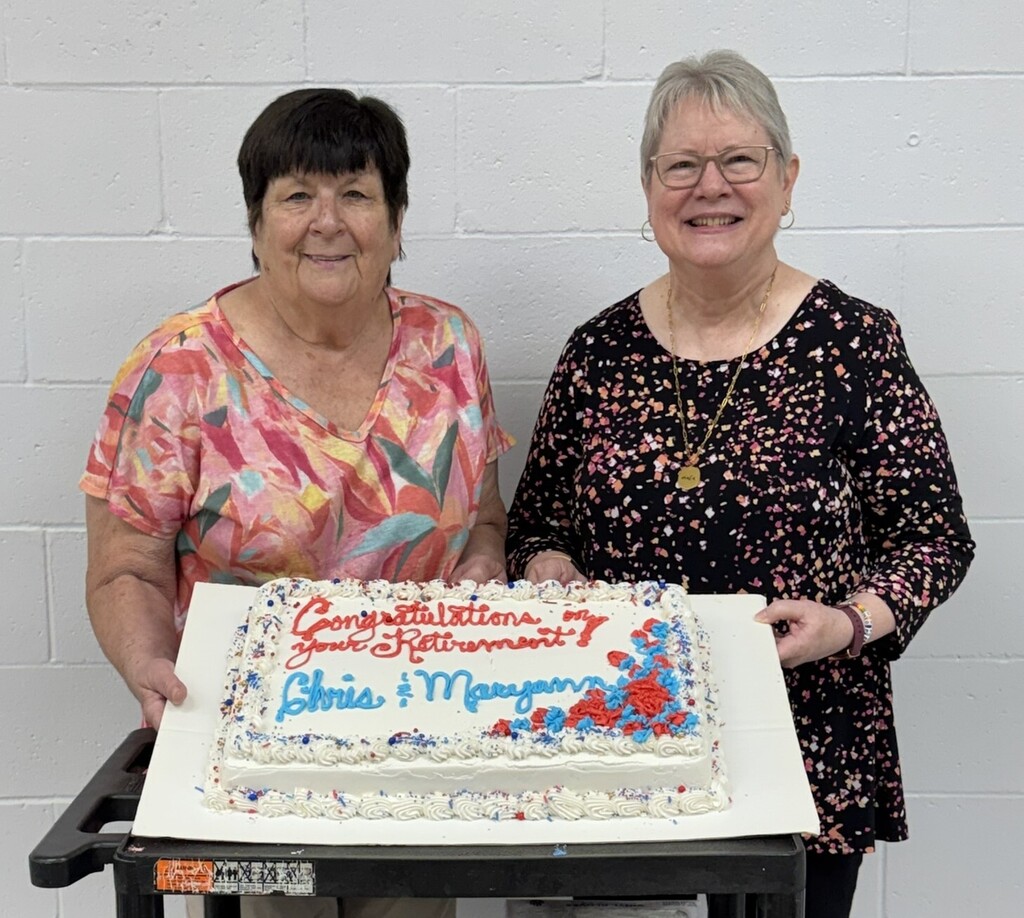 two ladies with a cake