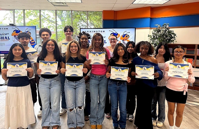 2026 Lexington City Schools Junior Marshals pose together in formal attire, recognized for academic excellence and leadership.