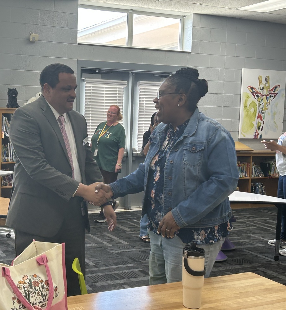 Alt Text: Lexington City Schools Superintendent Dr. Ron Anthony greets and speaks with a staff member during a district staff engagement meeting. The interaction took place as part of ongoing visits and conversations held across all six Lexington City Schools campuses focused on communication, collaboration, and employee engagement.