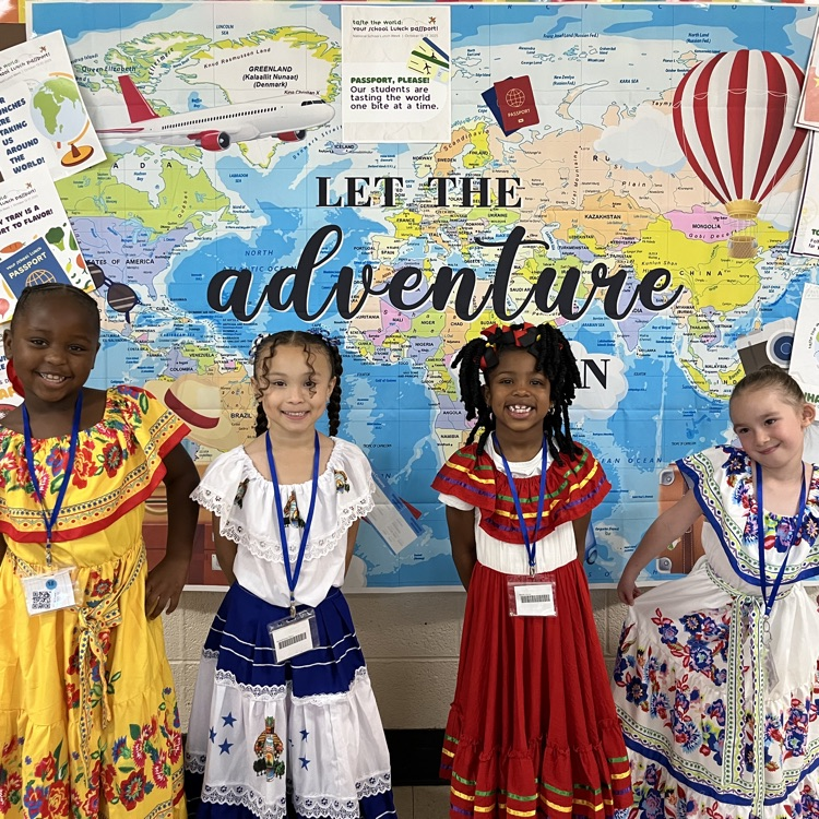 “Students and staff celebrating National School Lunch Week in the cafeteria.”