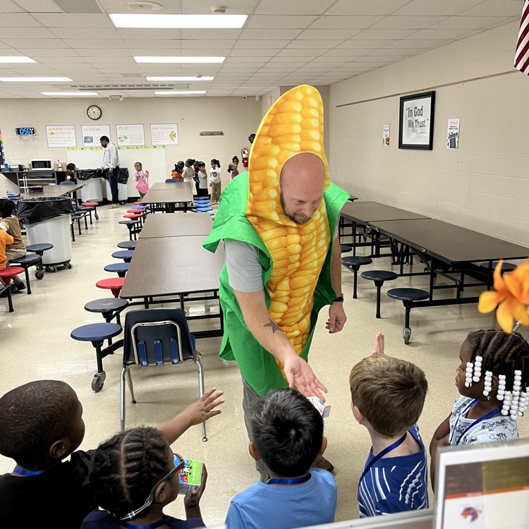 “Students and staff celebrating National School Lunch Week in the cafeteria.”