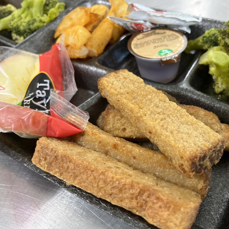 “Students and staff celebrating National School Lunch Week in the cafeteria.”