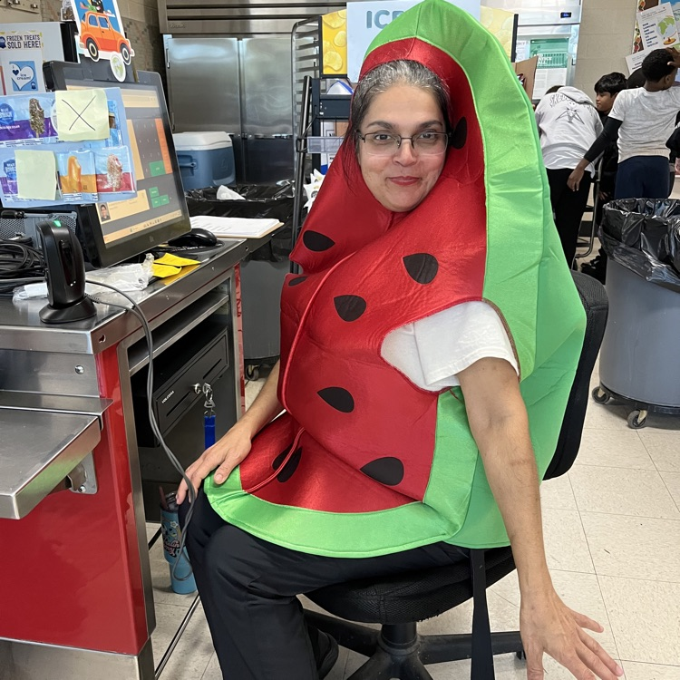 “Students and staff celebrating National School Lunch Week in the cafeteria.”