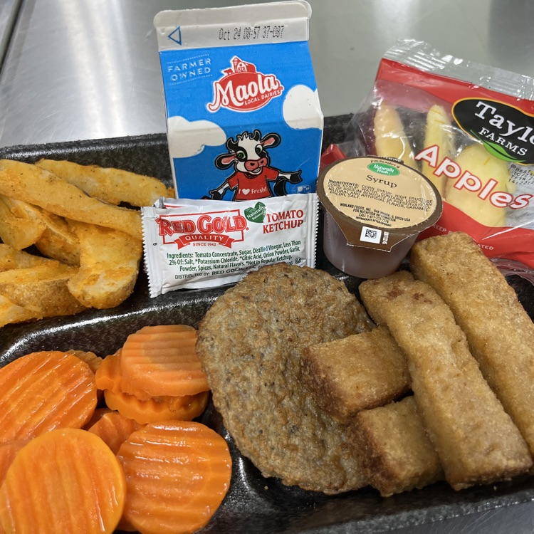 “Students and staff celebrating National School Lunch Week in the cafeteria.”