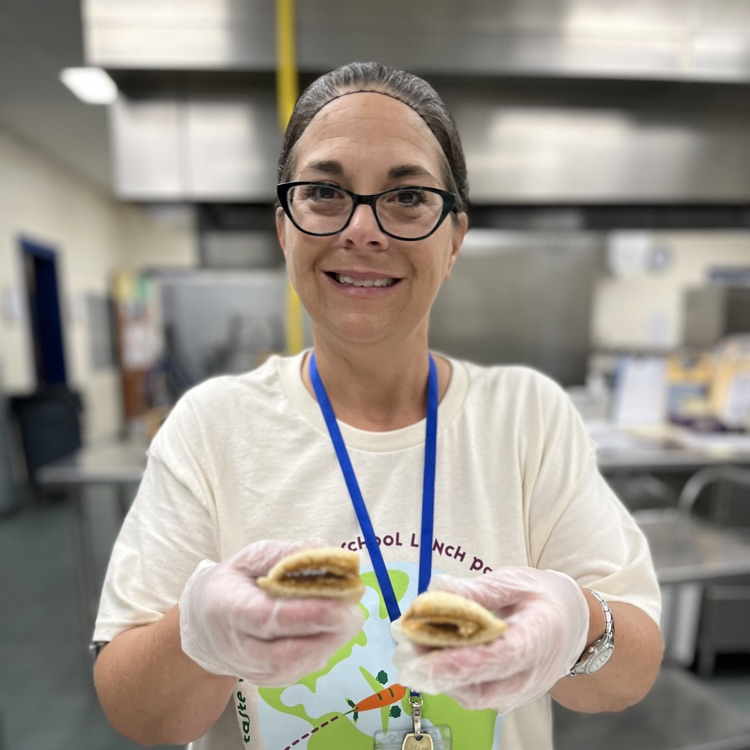 “Students and staff celebrating National School Lunch Week in the cafeteria.”